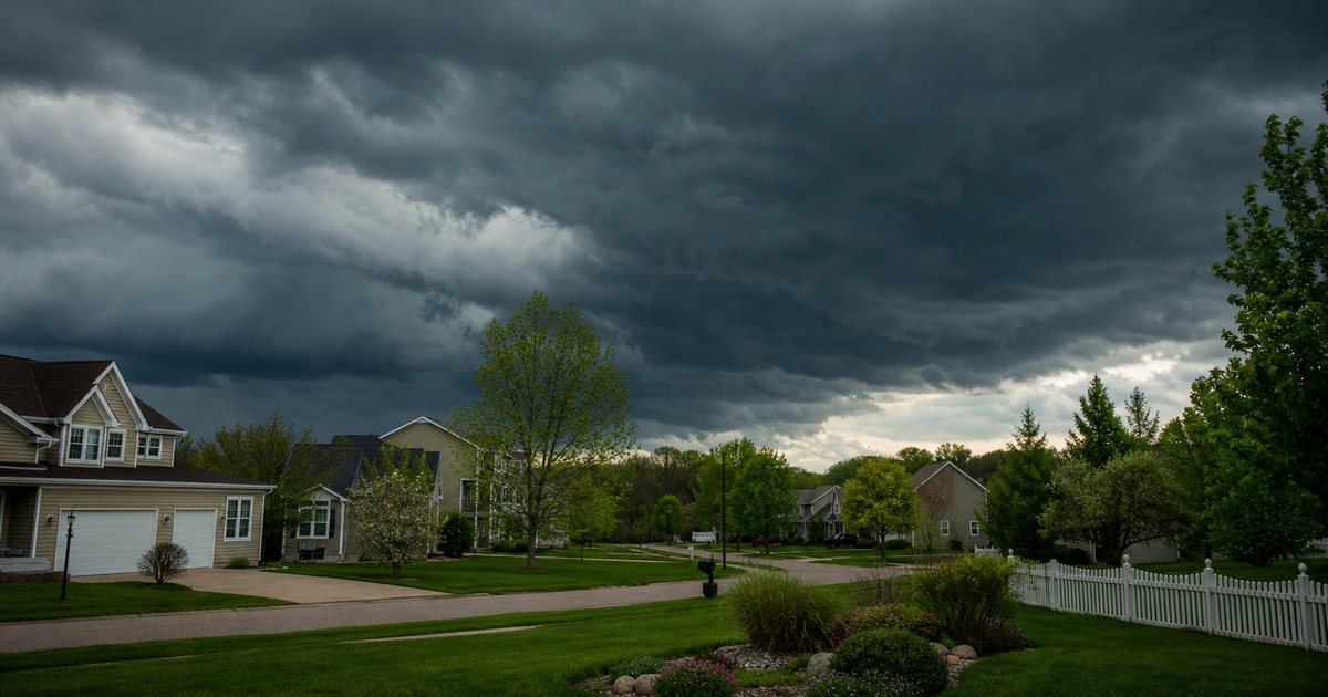 What weather signals should trigger a lawn care rescheduling decision each week?